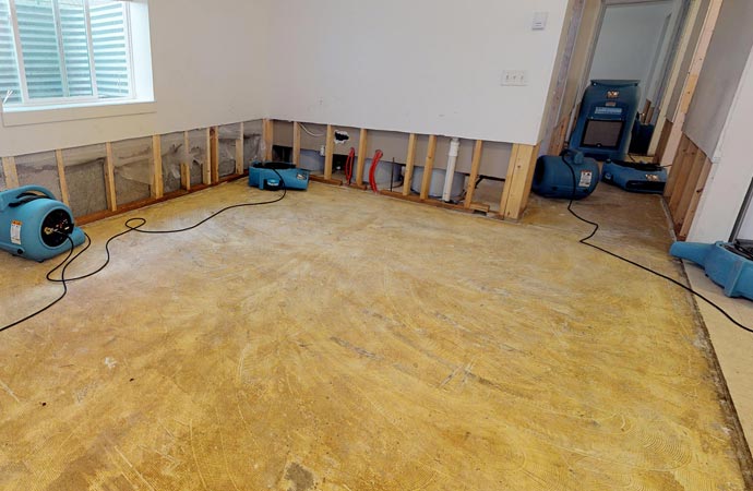 home water damage restoration with blue equipment